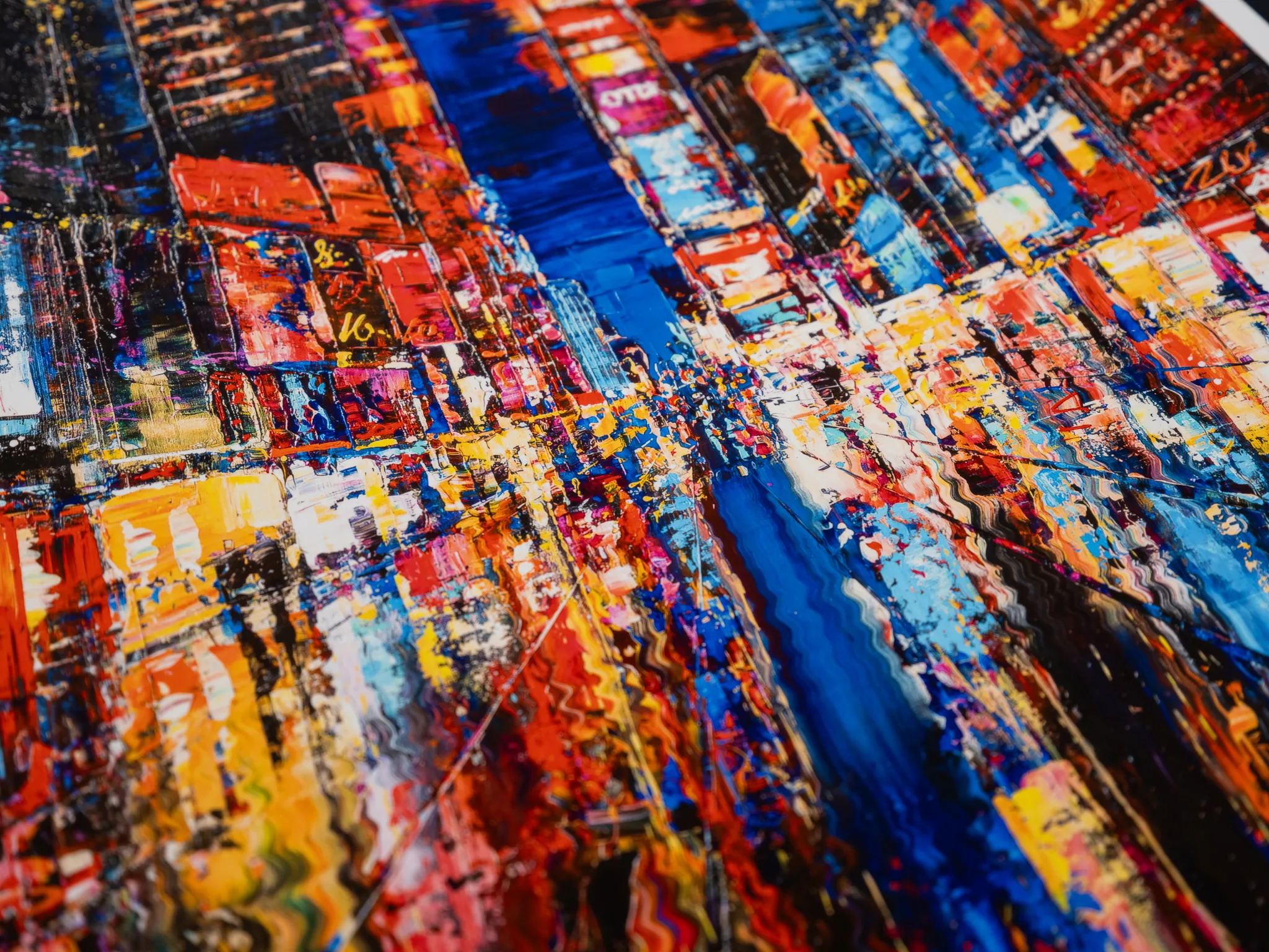 Close-up of Downtown Dazzle, a limited edition print by Paul Kenton, showing thick, textured brushwork of red, orange, yellow and blue depicting a New York street at night.