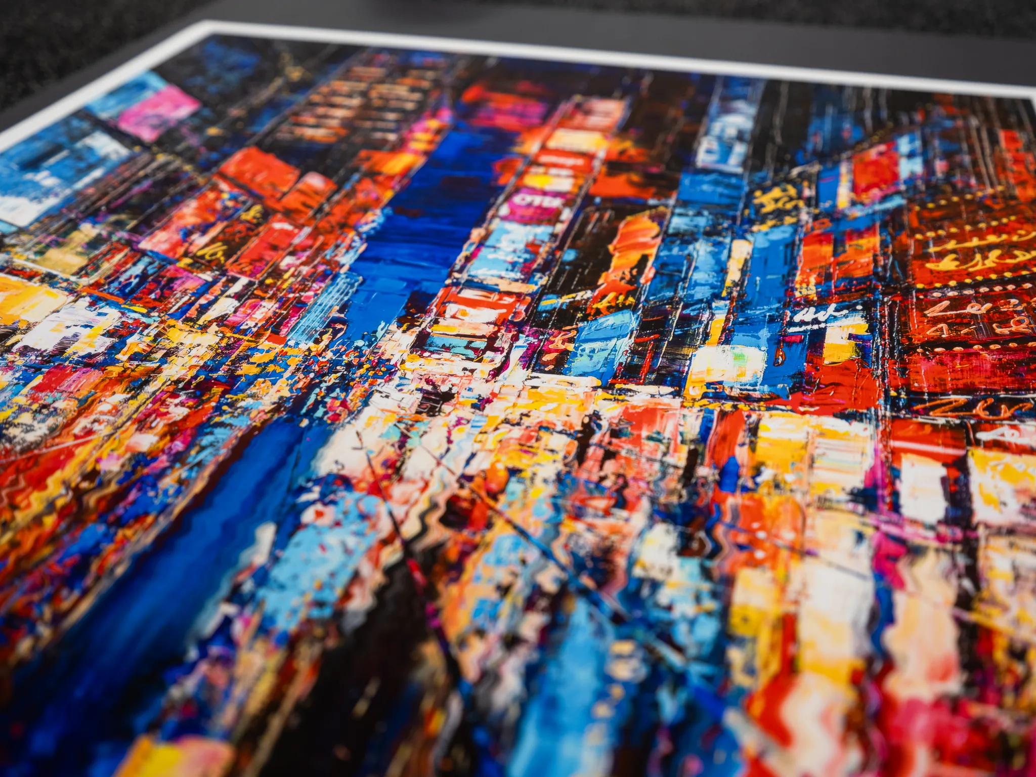Close-up of Downtown Dazzle, a limited edition print of New York streets: thick, textured blue, red, orange and yellow strokes suggest bright city lights and crowded blocks.
