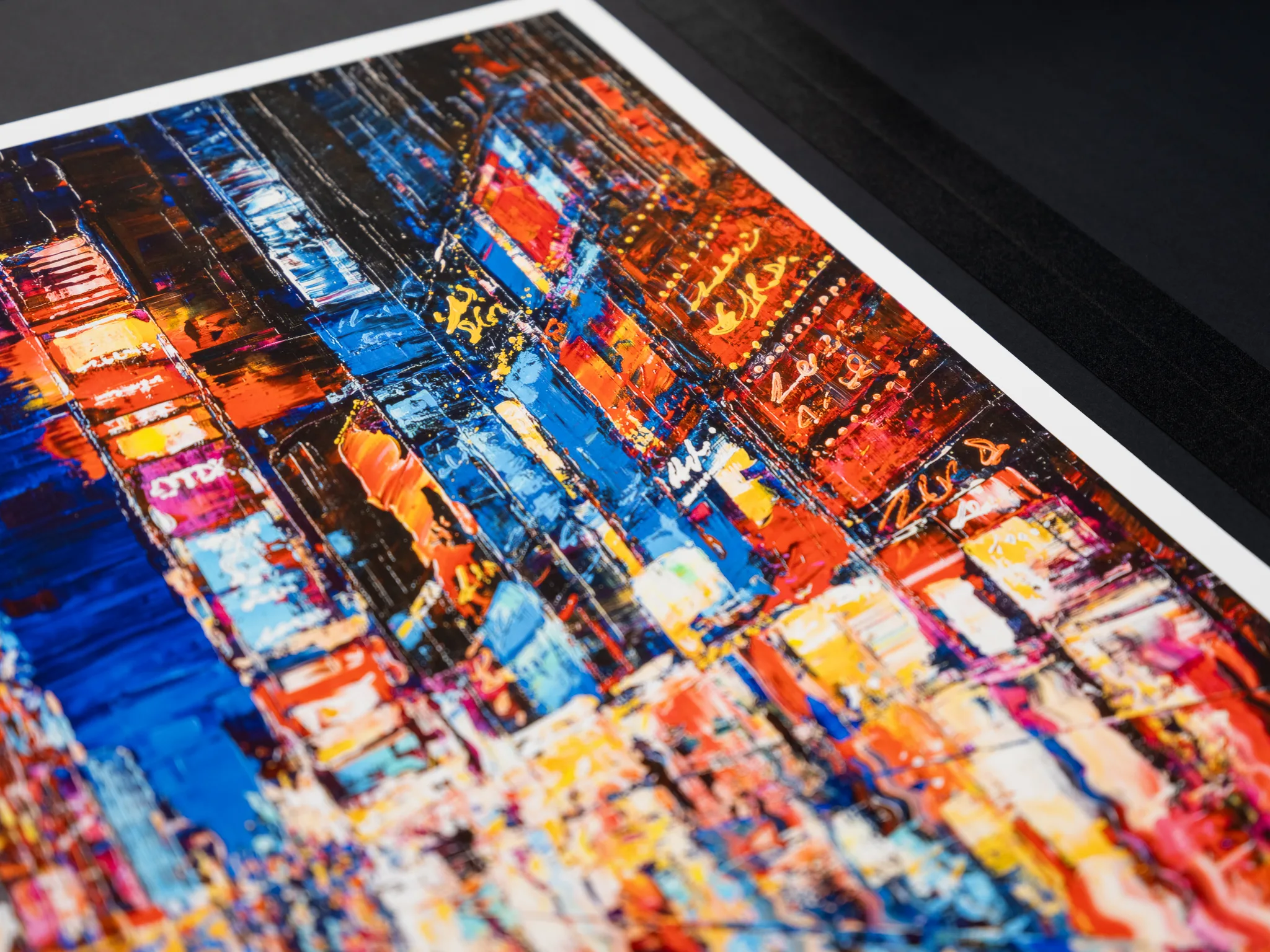 Close-up of Downtown Dazzle, a limited edition giclée print by Paul Kenton showing thick, textured brushwork of neon-lit New York street signs and buildings in vivid blues, reds and yellows.