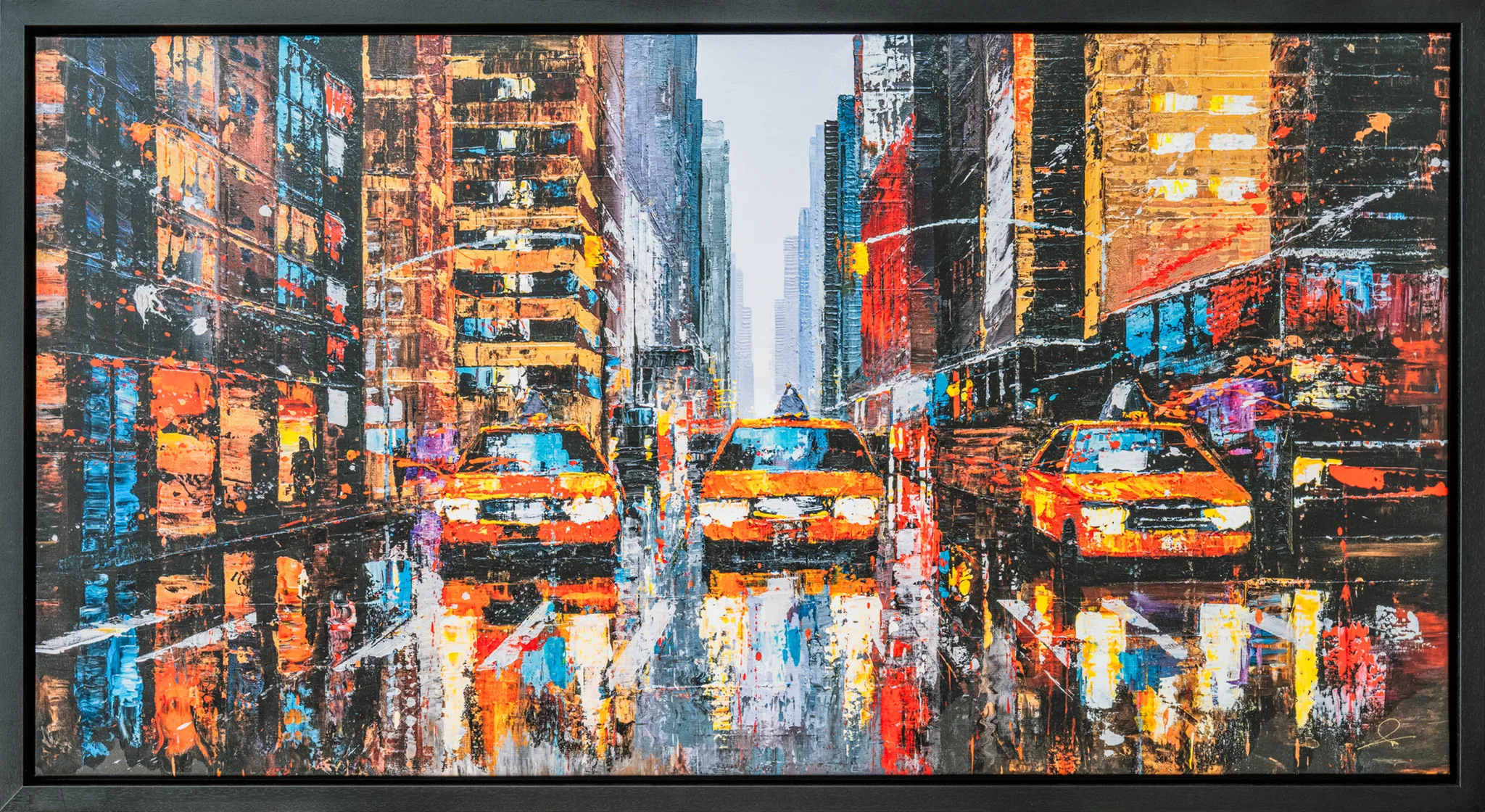 Downtown Reflections, a textured limited edition giclée print in a slim black frame, showing three yellow taxis in a rainy city street lined with tall buildings, glowing in orange, red and blue with reflections on wet pavement.