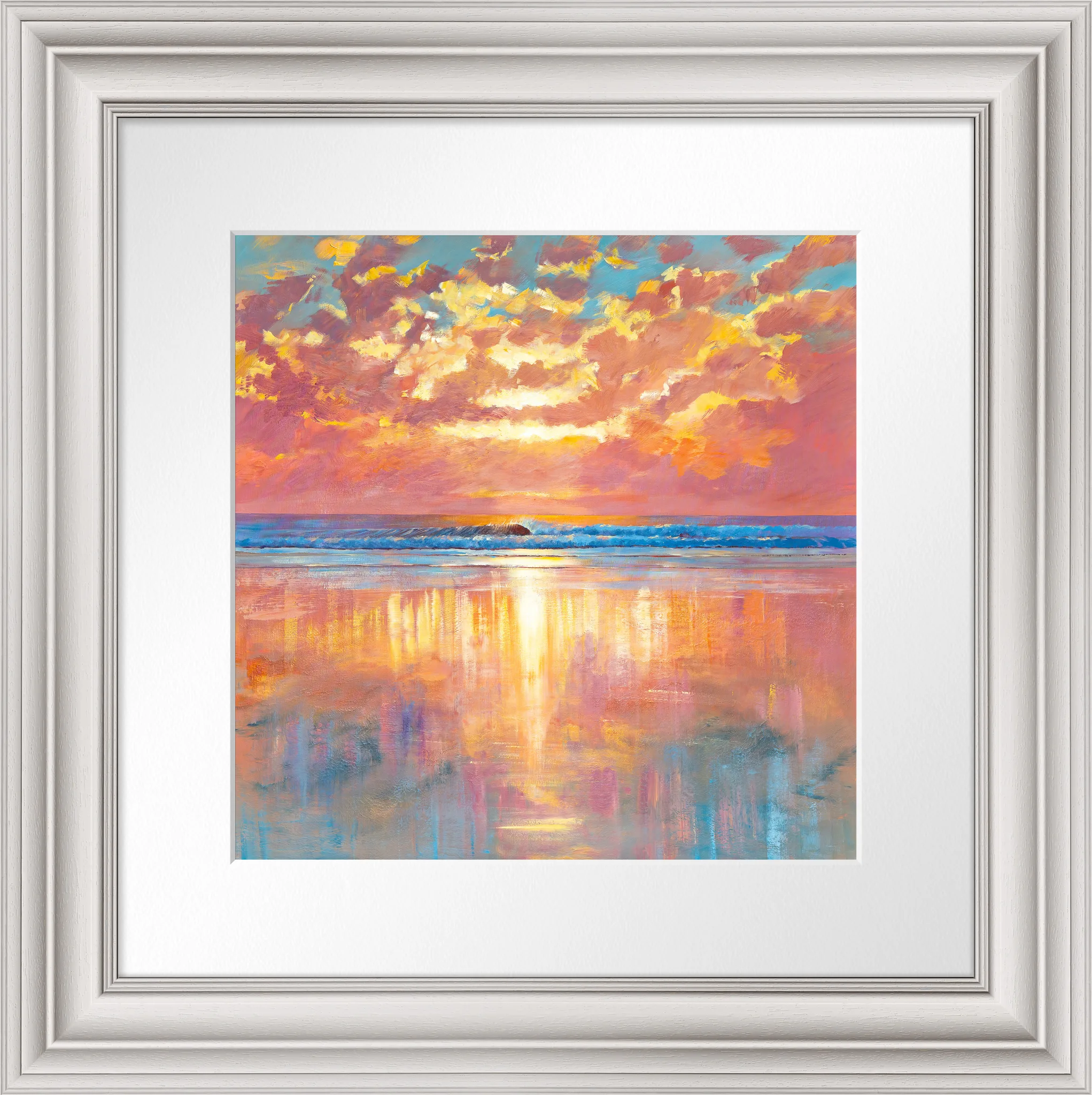 Ocean Harmony, a limited edition print by Paul Kenton in a pale silver frame with white mount: a sunset over the sea, with bold pink and gold clouds above glowing light reflected on wet sand.