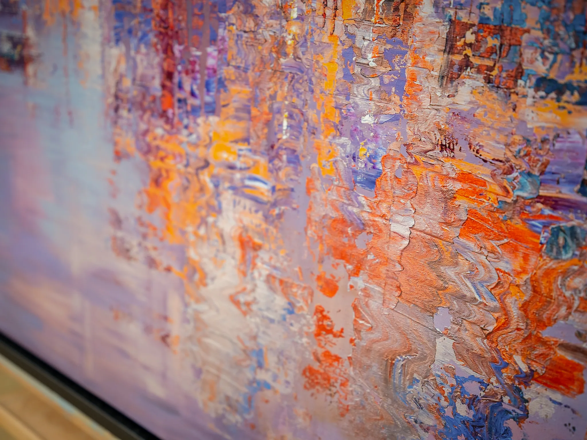 Close-up of Opalescent Venice, a limited edition print by Paul Kenton, showing thick textured strokes of orange, violet and blue catching the light across the surface.