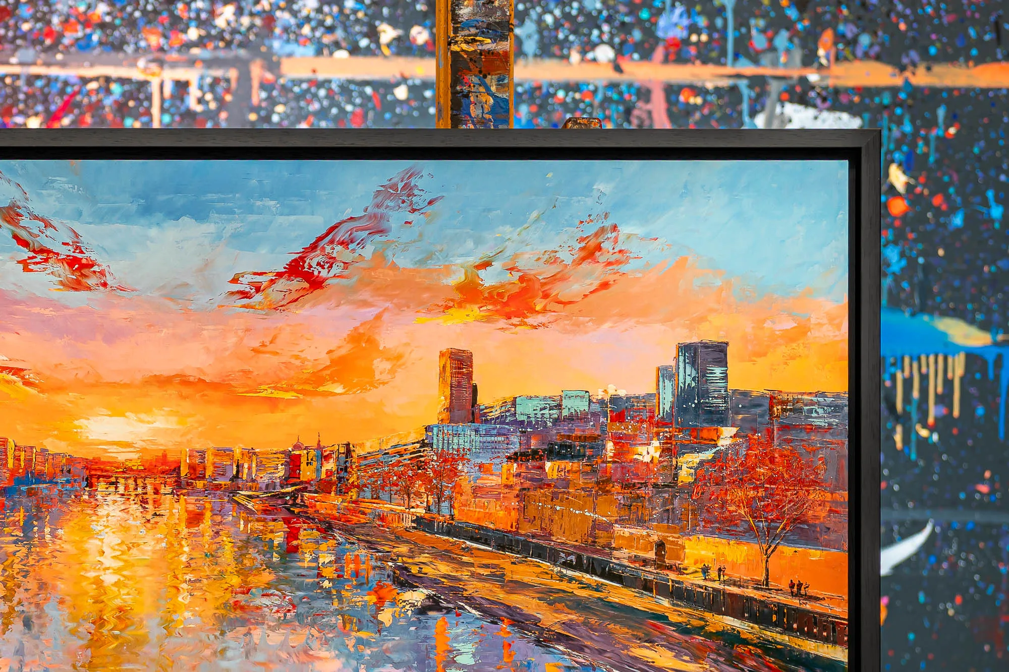 Close-up of Panoramic Glow, a limited edition print by Paul Kenton: a city skyline by a river at sunset, with orange and red skies, reflections on the water and textured, painterly brushwork.
