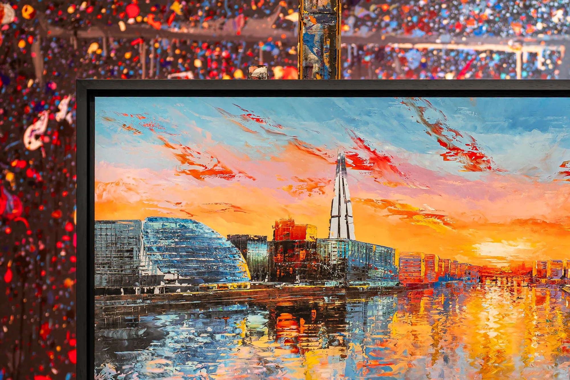 Detail of Panoramic Glow, a limited edition print by Paul Kenton: a London riverside at sunset, with a tall glass tower, orange and red skies and textured golden reflections on the water.