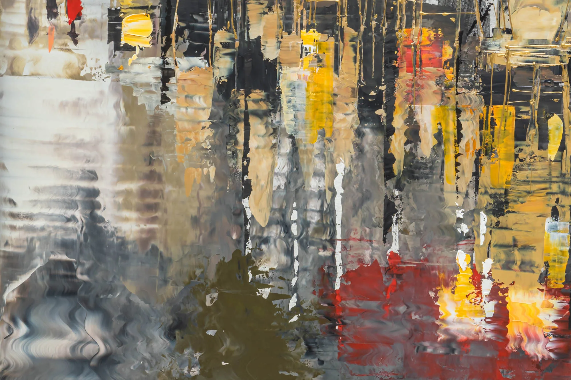Close-up detail of Parisien Life, a limited edition print by Paul Kenton, showing vertical streaks of black, cream, gold and red paint dripping over grey, suggesting reflected city lights in rain.