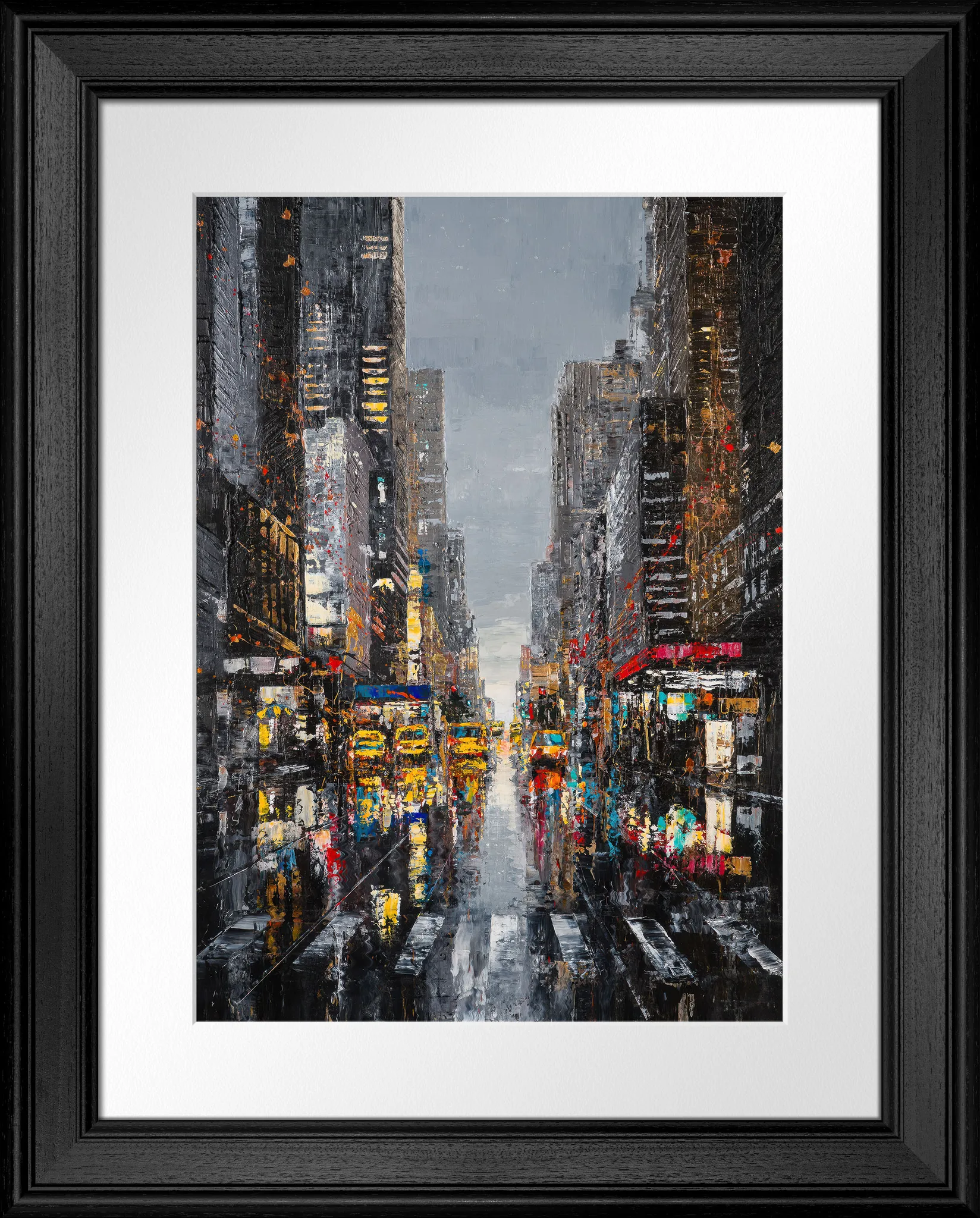 Shades Of The City, a limited edition print in a black frame with white mount: a rain-soaked New York avenue of tall grey towers, with yellow taxis and neon glowing under a pale grey sky.