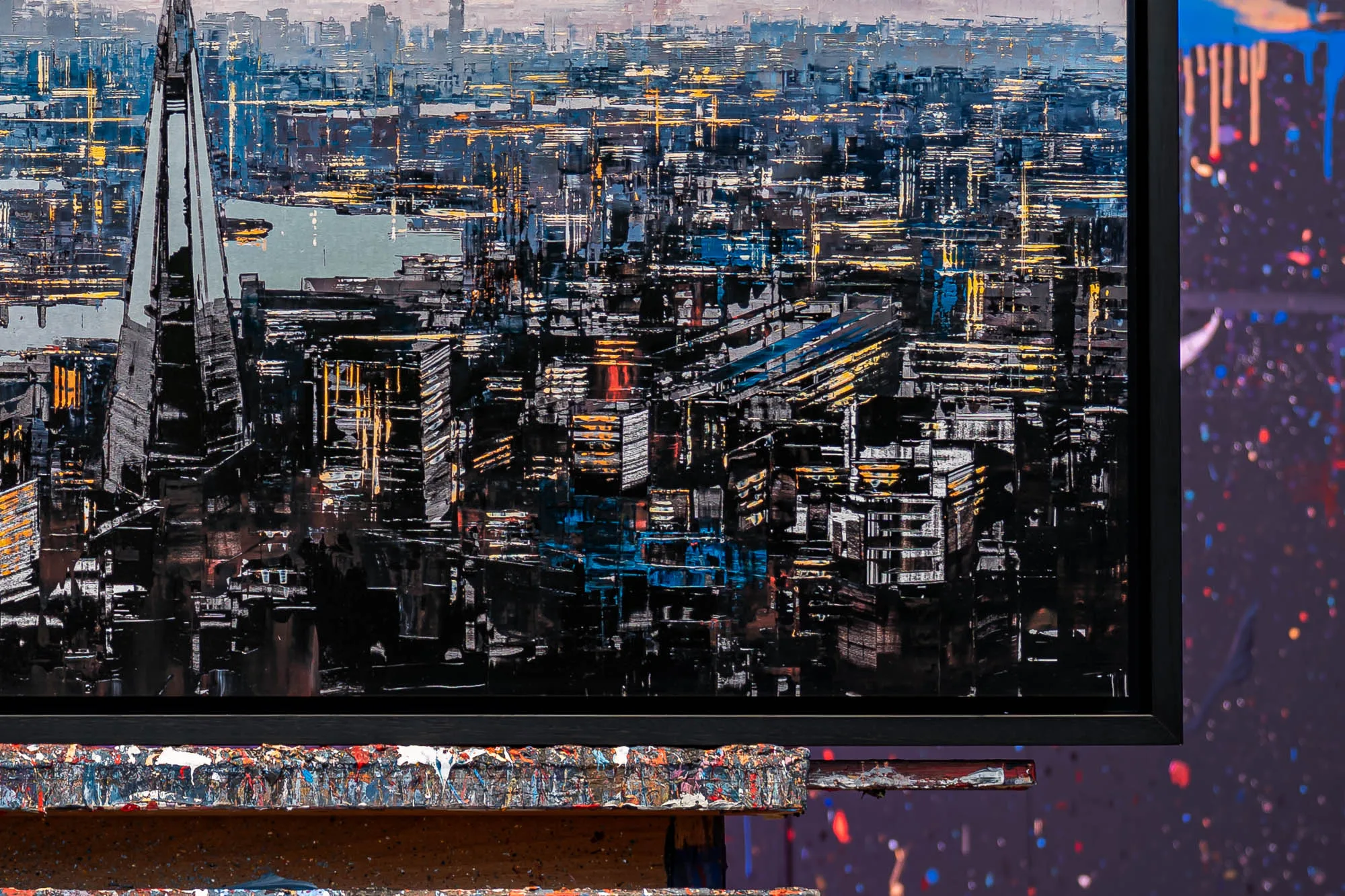 Close-up of Vista Reflections, a limited edition print by Paul Kenton, showing a dense London skyline of dark towers, glowing amber and blue lights and the Shard on the left.
