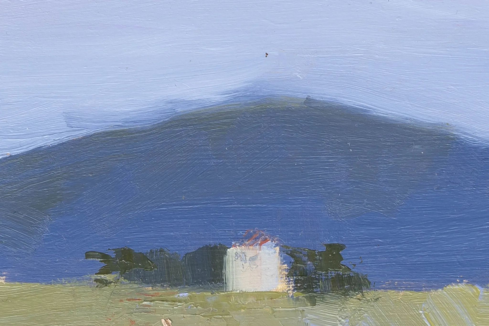 Close-up of Italian Escape, an original oil painting by Paul Kenton, showing a small white house with dark green trees beneath a blue hill and pale sky, with loose, textured brushwork.