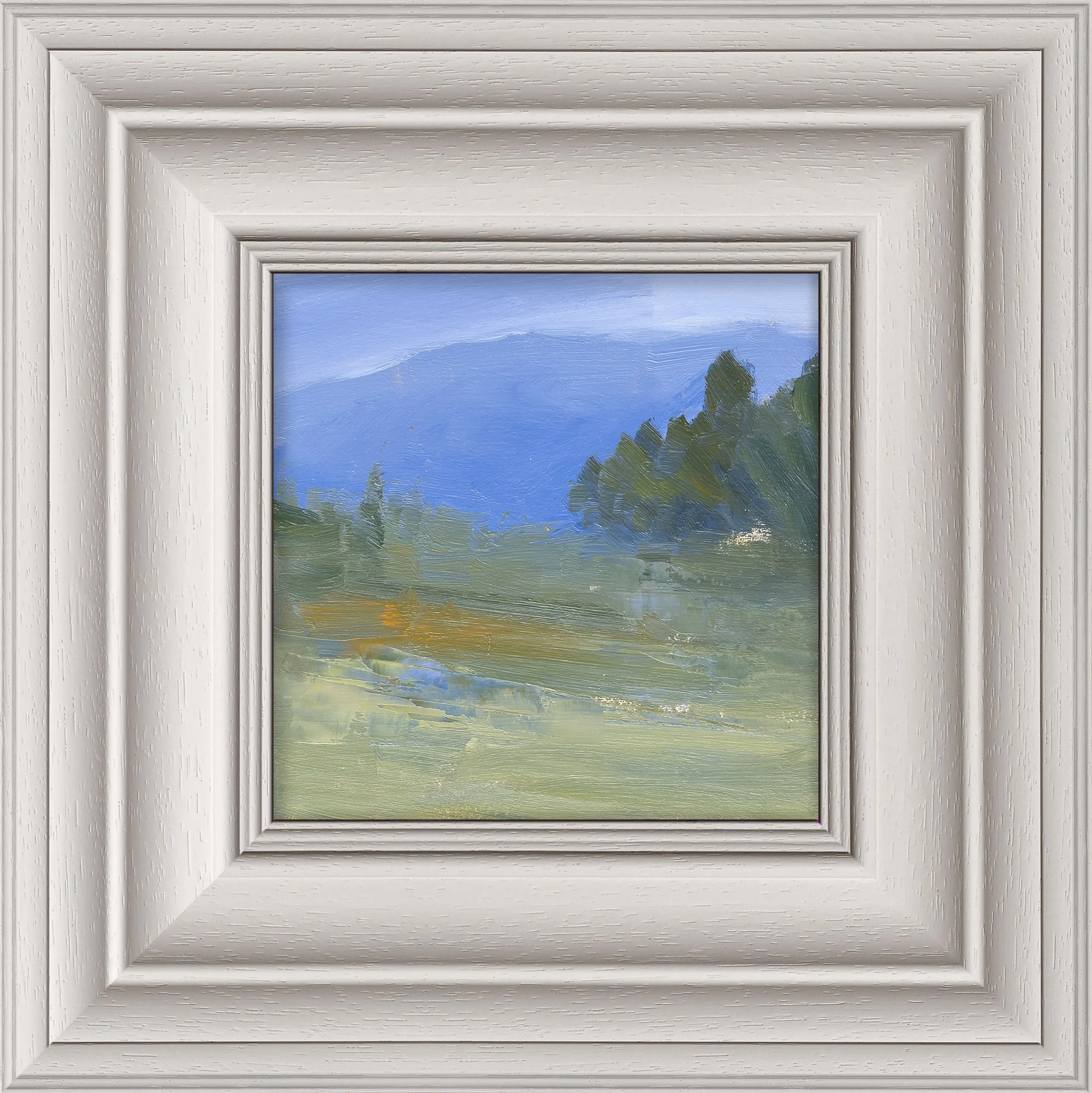 Italy Trip, a small original oil on board painting by Paul Kenton in a wide, pale grey-white frame. It shows a misty Tuscan landscape: blue hills, dark green trees on the right and soft green fields.