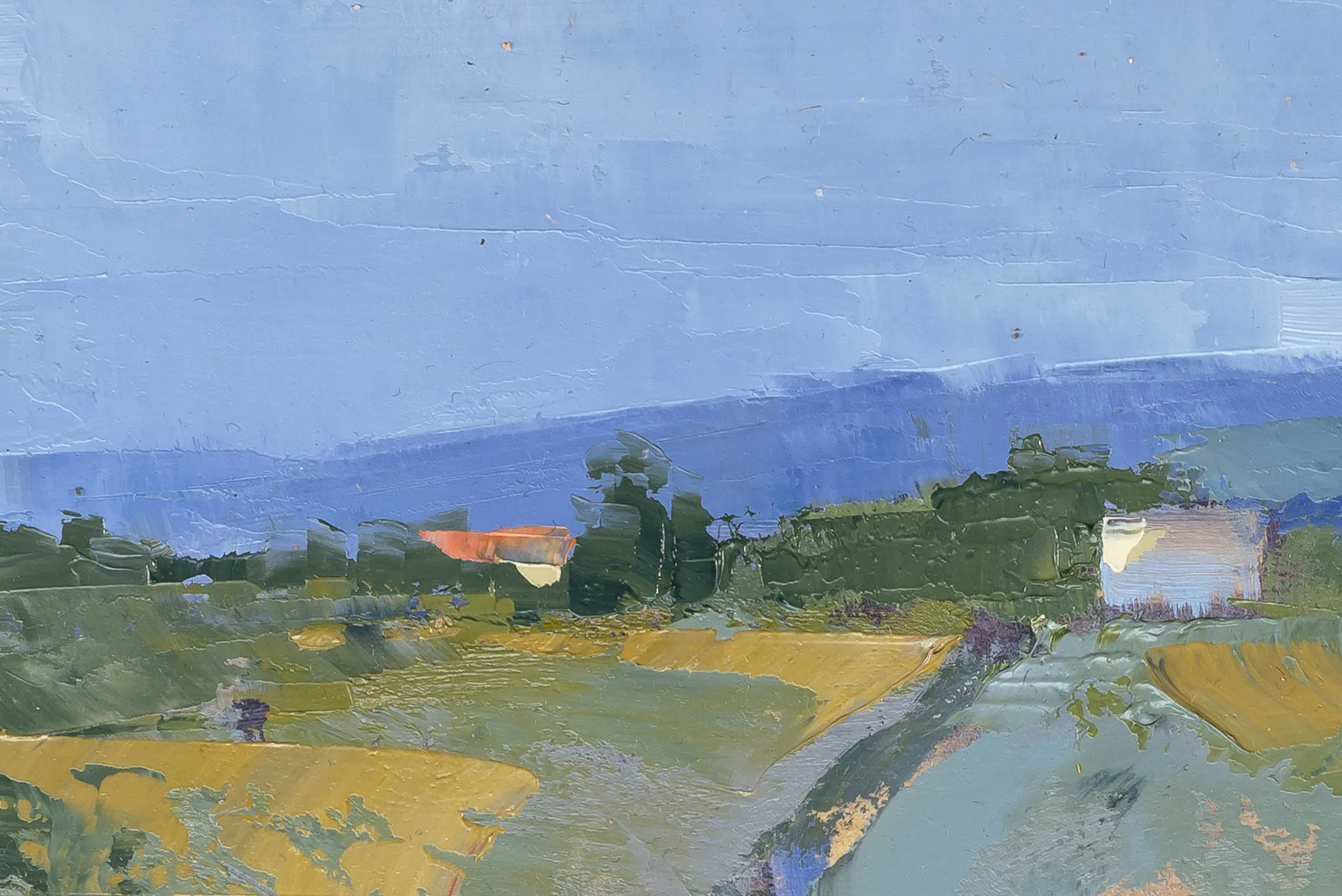 Close-up of Italian View, an original oil on board painting by Paul Kenton, showing thick textured brushwork of a Tuscan valley beneath a pale blue sky, with ochre fields, green hedgerows and a small terracotta-roofed house.
