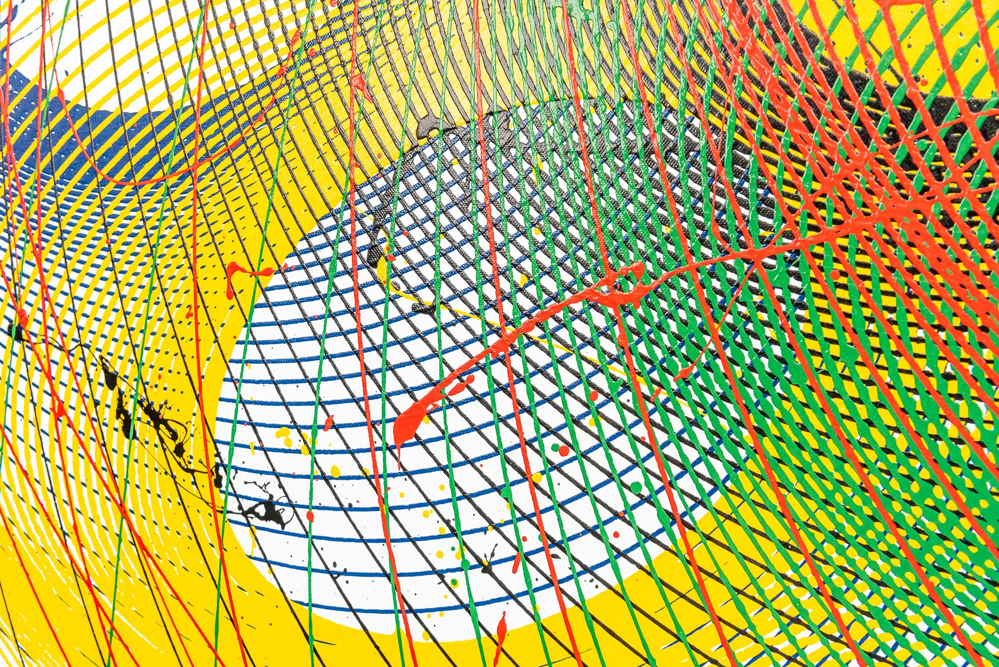 Close detail of Olympic Hope: crossing lines of yellow, green, red and blue paint with small splashes