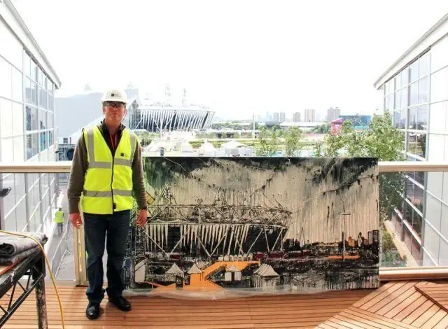 A man in a hard hat, safety glasses and high-visibility vest looking through binoculars across the Olympic Park