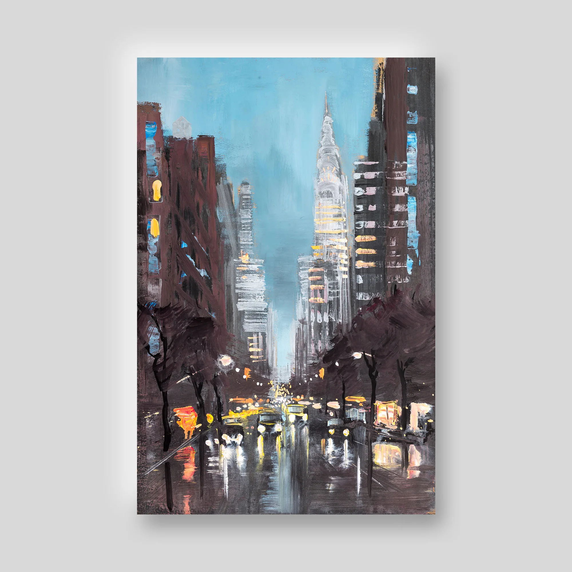 Chrysler Shines, a limited edition print by Paul Kenton: a dusk street in New York, the illuminated Chrysler Building spire rising above dark towers under a pale blue sky, with wet reflections of warm lights below.