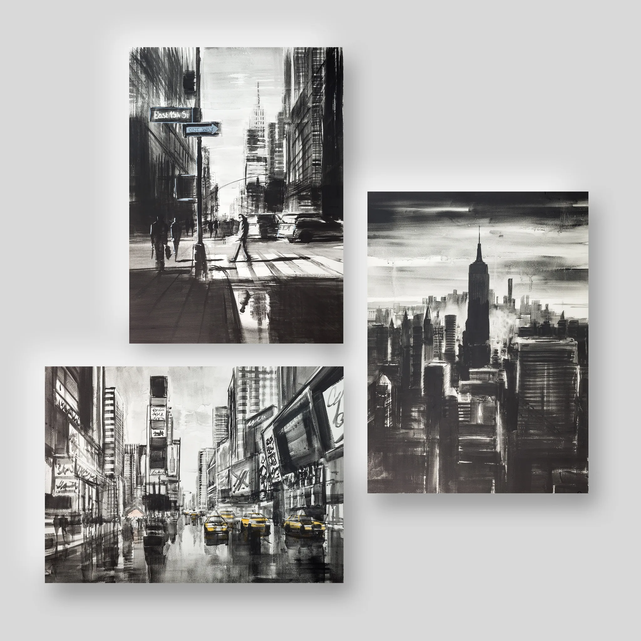 New York Black & White, a print collection set by Paul Kenton: three monochrome ink-style city scenes, including a street crossing, a hazy Empire State Building skyline and a rainy Times Square with yellow taxis.