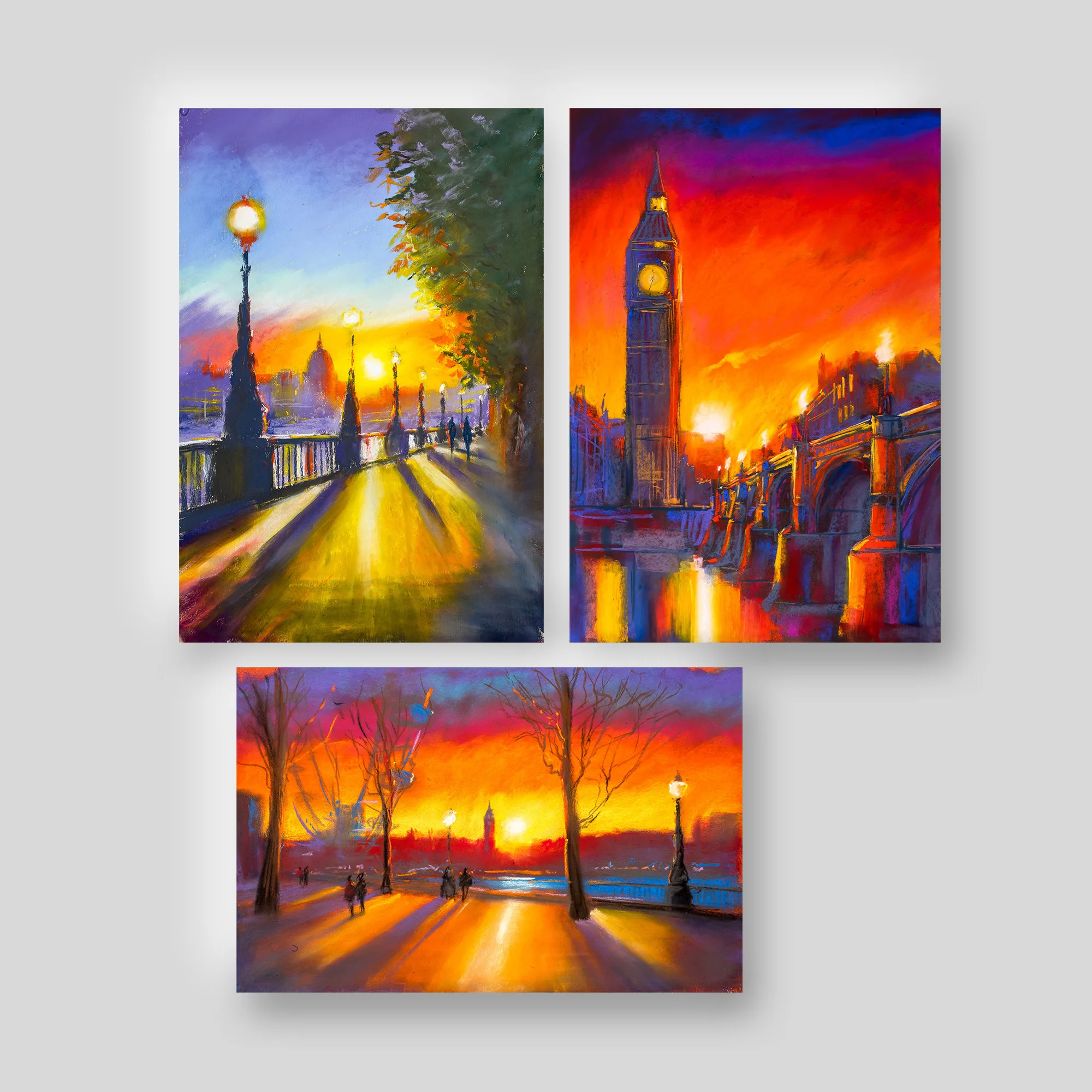London Sunsets in Pastels, a set of three prints by Paul Kenton: Big Ben against a fiery orange sky over Westminster Bridge, a lamplit riverside path and a tree-lined walkway at dusk.