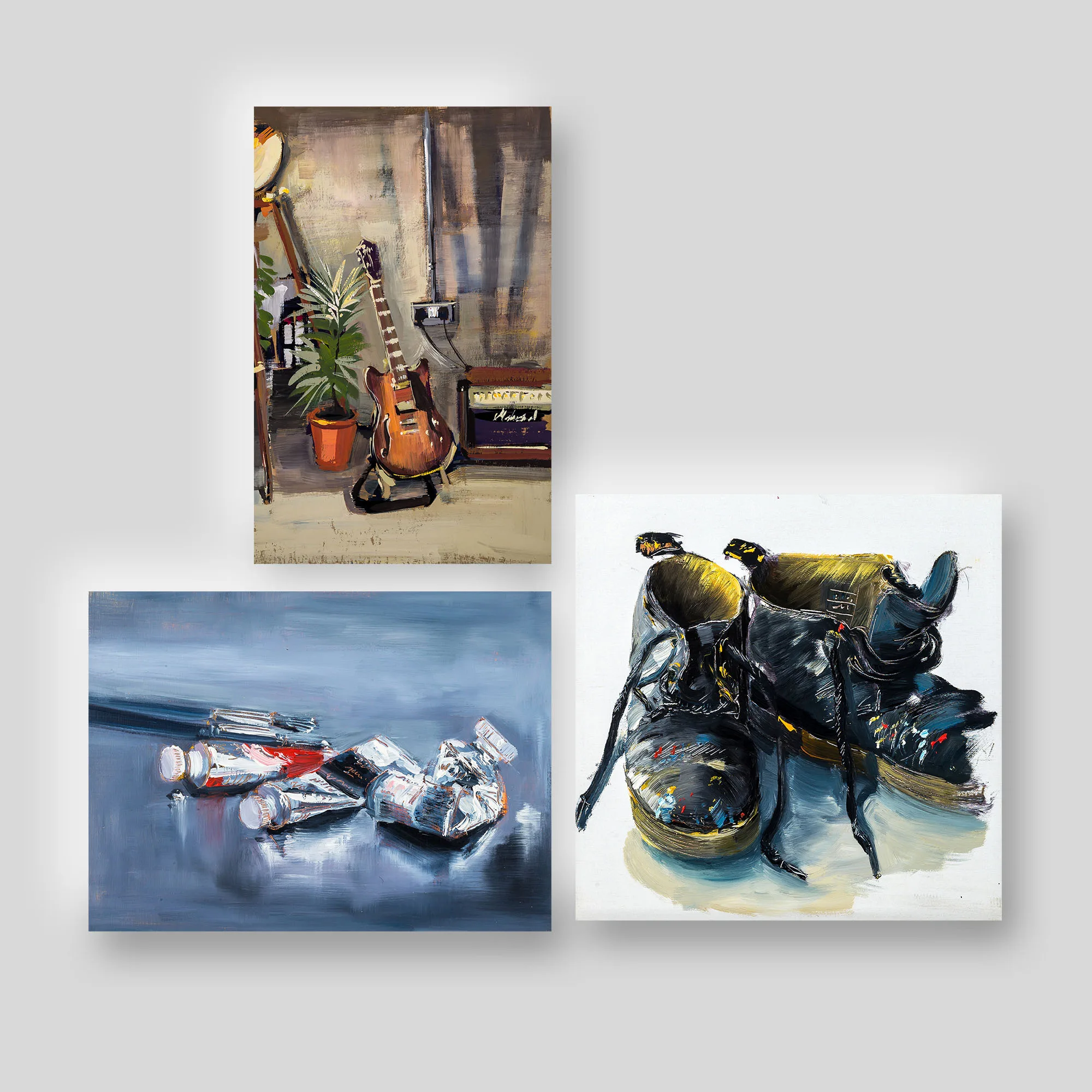 Still Lifes, a print collection set by Paul Kenton: three giclée prints of an electric guitar by a potted plant, squeezed paint tubes on blue-grey, and paint-splashed black boots.