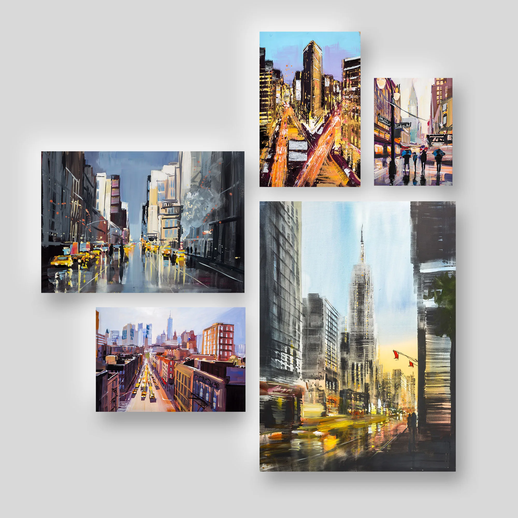 Streets of New York II, a print collection set by Paul Kenton: five bold, textured New York street scenes on a pale grey wall, including rainy avenues with yellow taxis and the Empire State Building at sunset.