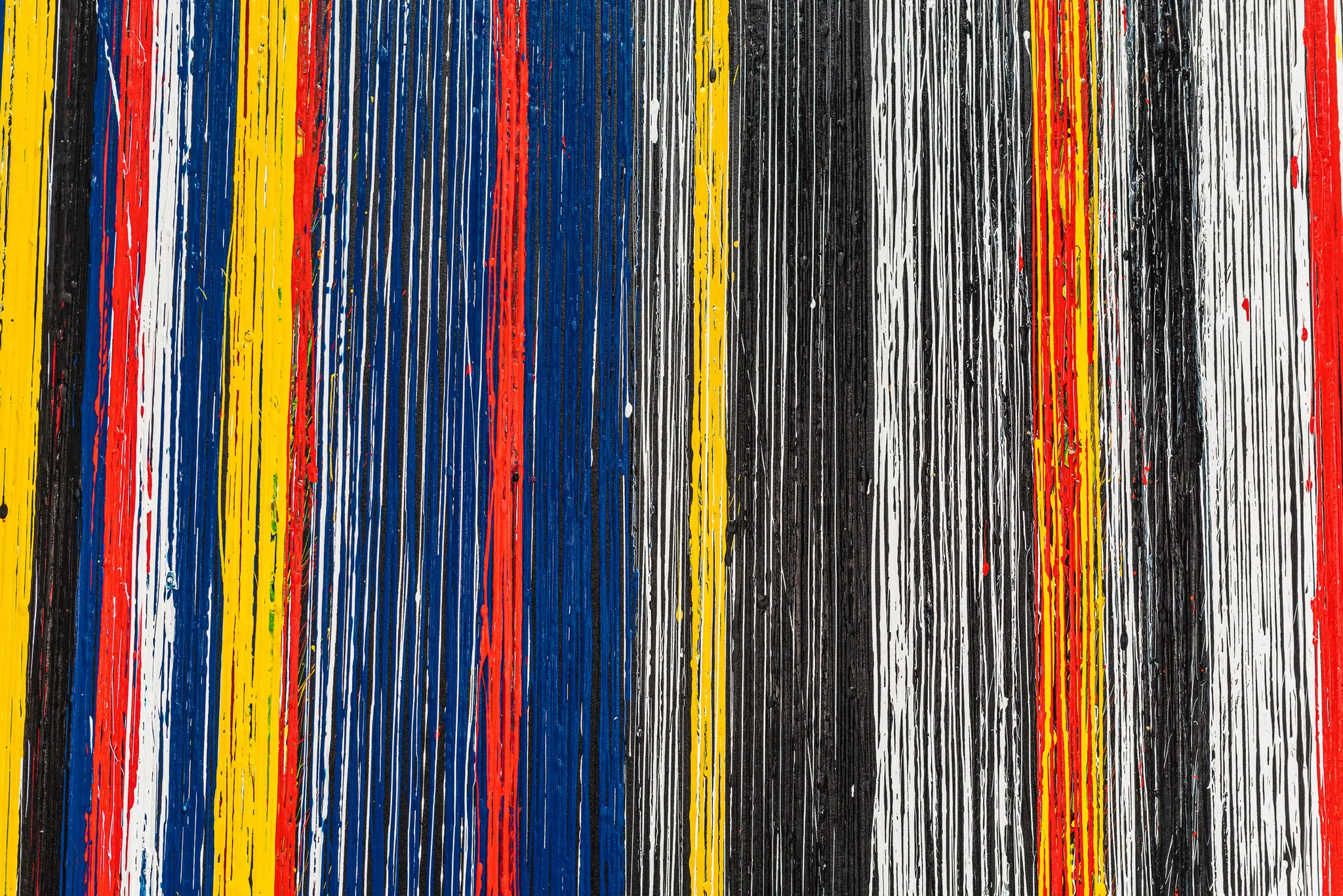 Detail of Uniform Oscillation, an original acrylic painting by Paul Kenton: vertical bands of yellow, red, blue, black and white paint, with drips and fine streaks running downwards.