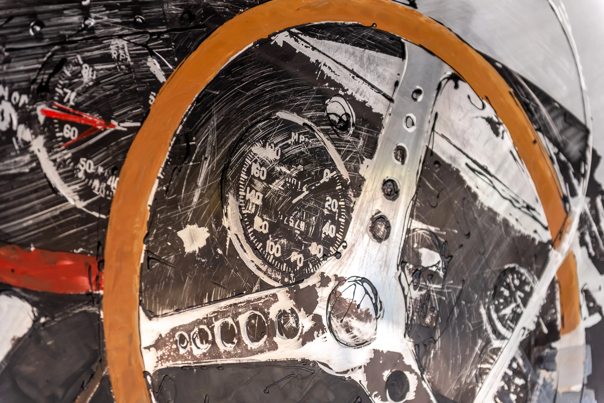 Start with the Checklist, an original mixed media painting on aluminium: a monochrome steering wheel with an orange rim and a central dial of speedometer and gauges, scratched and textured in grey and black.